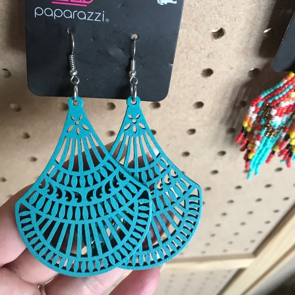 Teal laser cut wooden earrings.